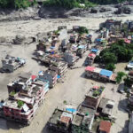 Rasuwa [Nepal], Aug 26 (ANI): An aerial view of the houses partially submerged in mud-laden flash flood following an outburst in the Bhotekoshi River, in Rasuwa on Wednesday. (ANI Video Grab)